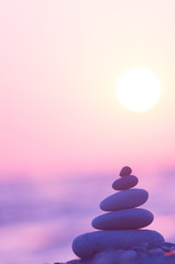 stack of zen stones on pebble beach