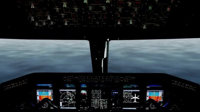 A cockpit view of an airplane performing low level flying over water.