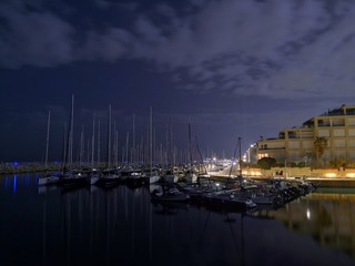 Fototapeta na wymiar Yachts in marina at night (Herzliya Marina at night )