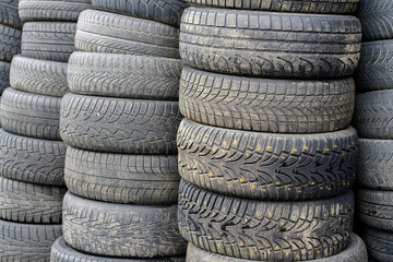 old used car tyres, stacked at car service