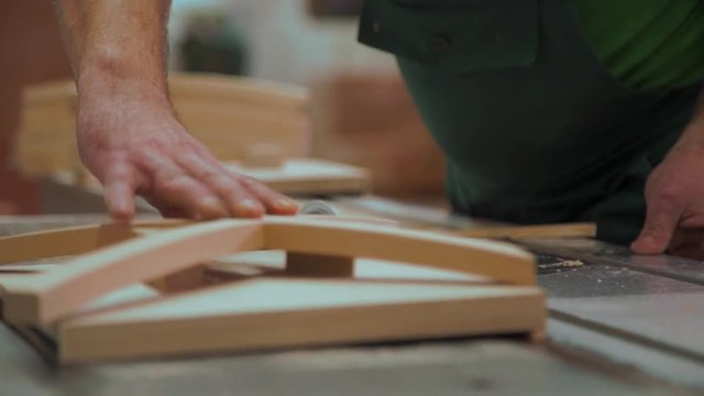 Milling in a wooden beam.Video footage of wood processing. circumcision is unnecessary from a piece of wood