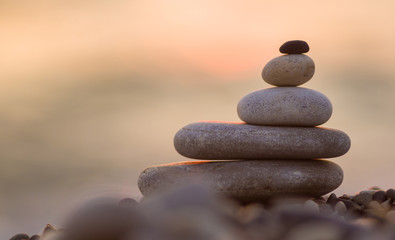 stack of zen stones on pebble beach