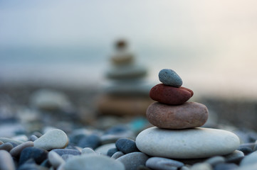 stack of zen stones on pebble beach