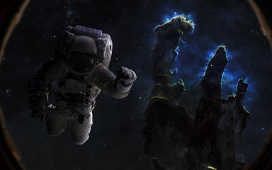 Astronaut and Pillars of Creation. Beautiful space landscape in porthole. Science fiction art. Elements of the image were furnished by NASA