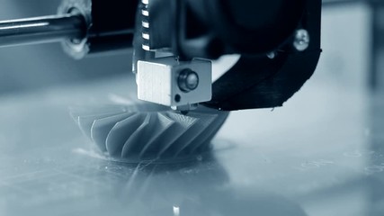 3D printer working. Fused deposition modeling, - Powered by Adobe