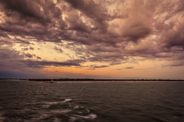 Panorama of Punta Sabbioni lighthouse in the Venice lagoonduring a thunderstorm