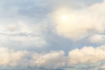 Cumulus fluffy clouds, sky with sun background texture, epic dramatic heaven