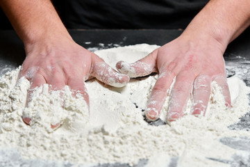 Obraz na płótnie Canvas Homemade culinary traditional prepare. Hand of chef with flour close up.