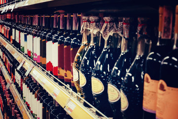 Showcase in a wine shop with bottles of wine and champagne