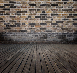 room with bricks wall and wooden floor