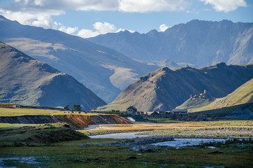 Colourful Truso Valley Gorge view of Ketrisi village and Zakagori fortress, river and mountains in the background