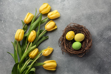 Happy Easter. Congratulatory easter background. Easter eggs and flowers.