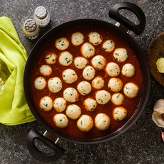 cheese veggie ricotta meatballs in tomato sauce in a pan. traditional Italian cuisine for the whole family, party or restaurant menu