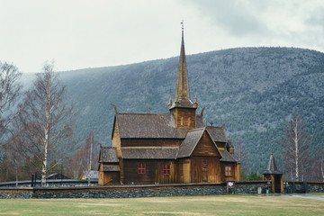 Fototapeta na wymiar Traditional medieval stave church Lom in Norway, dates from the 12th century. Ancient wooden building.