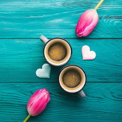 Fototapeta na wymiar Two coffee cups, hearts and flowers. Valentine day