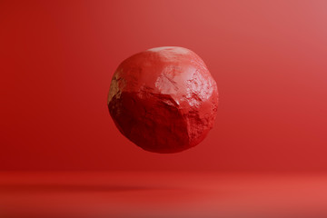 Levitating red ball in the studio