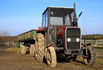 Obraz premium tractor with a trailer on the farm, Poland