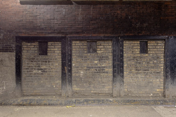 Fototapeta na wymiar Vintage two tone brick wall in urban alleyway