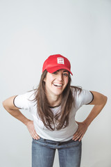 Happy beautiful woman with red hat in studio