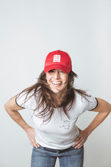 Fototapeta premium Happy beautiful woman with red hat in studio