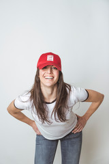 Fototapeta premium Happy beautiful woman with red hat in studio