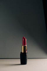 Pink lipstick on modern background. Product and make up  concept