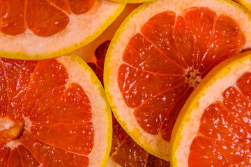 Background of sliced juicy grapefruit. Healthy eating