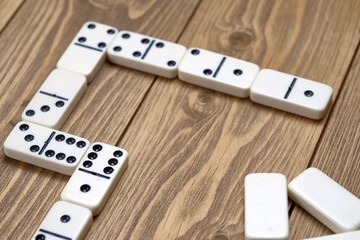 Fototapeta na wymiar white domino on wooden table