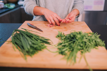 a person is cooking vegetables in a nice kitchen