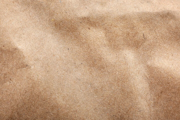 Brown paper bag texture as background, top view