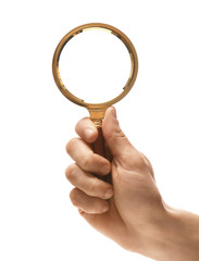 Woman holding magnifying glass on white background, closeup