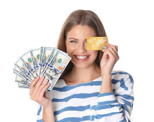 Portrait of happy young woman with money and credit card on white background