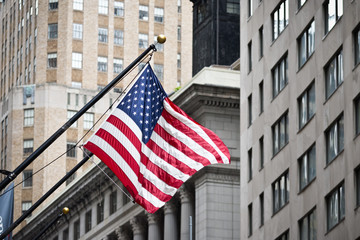 Wall street American flag in the Financial District of Lower Manhattan