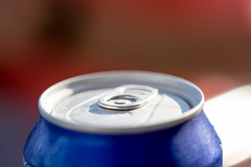 Close-up view of the top of a can drink with condensation.