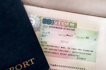 Two travelers passports with a Schengen visa. Euro-trip. Selective focus.