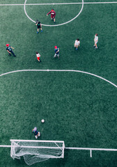 Group of kids playing soccer football  aerial view