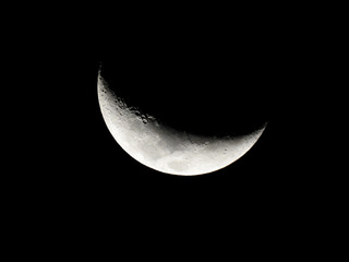 Crescent Moon / The Moon as it appears early in its first quarter or late in its last quarter, when only a small arc-shaped section of the visible portion is illuminated by the Sun