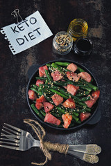 Green beans with bacon in a cast iron skillet. Healthy eating concept. Keto diet. Pegan diet. Paleo...