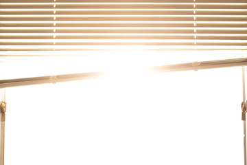 Golden sunlight streaming in through window and blinds, ideal for background warm hopeful feel