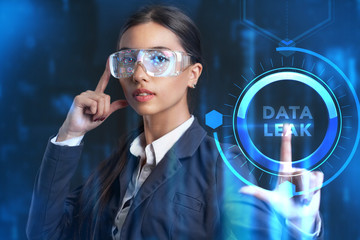 Business, Technology, Internet and network concept. Young businessman working on a virtual screen of the future and sees the inscription: Data leak