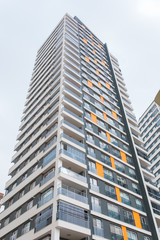 Fototapeta premium New multi-storey residential building apartment houses. Mortgage and construction background concept image.