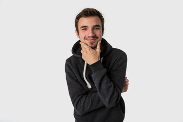 Thoughtfull caucasian young man. Isolated on white background. Thinking concept.