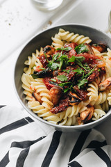 Delicious pasta with tomatoes, mussels and herbs	