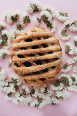 Fresh baked homemade sweet roll and flowers