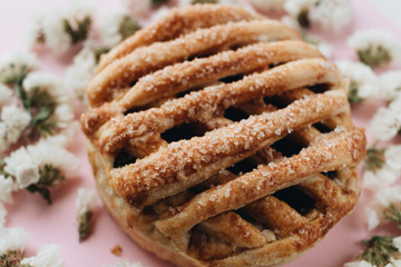 Fresh baked homemade sweet roll and flowers
