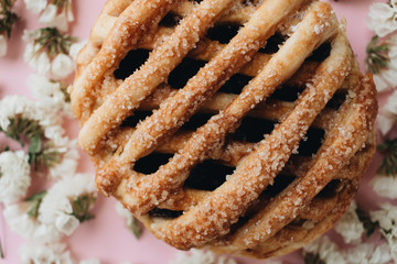 Fresh baked homemade sweet roll and flowers