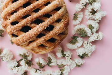 Fresh baked homemade sweet roll and flowers