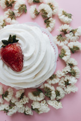 Piece of delicious fresh pastry and floral petals 