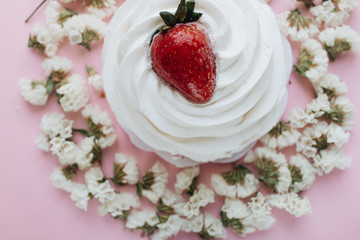 Piece of delicious fresh pastry and floral petals 