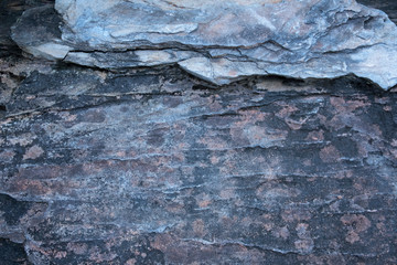 Big Rough stone with rugged crack surface. And there is moss on rock surface Occur naturally.